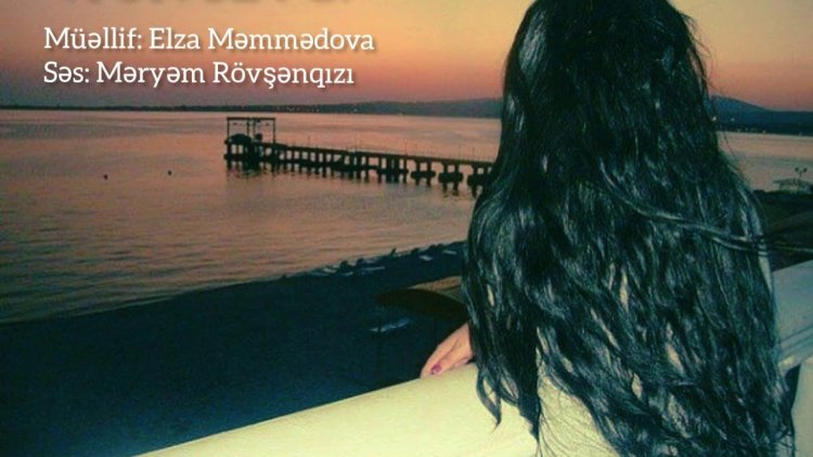 Брюнетка с длинными волосами на море