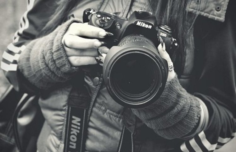 Фотограф девушка с фотоаппаратом