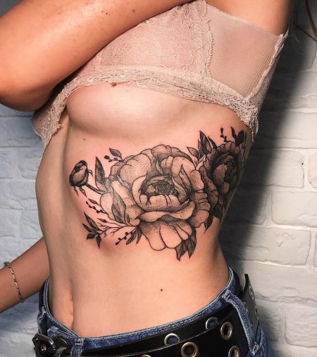Тату на боку женские