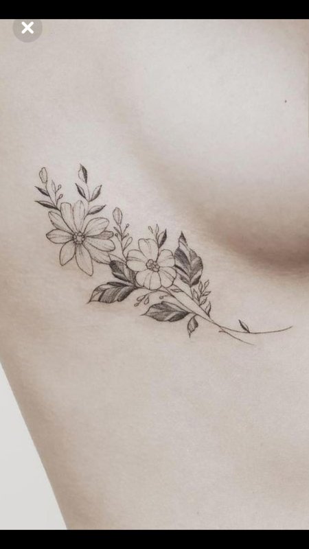 Тату веточка под грудью