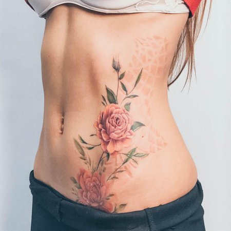 Женские татуировки на животе